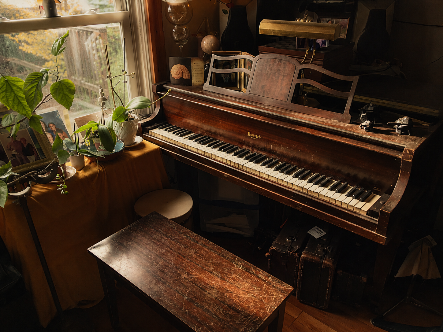 spk-piano-warmed Warmly lit piano and sheet music for SPK Music